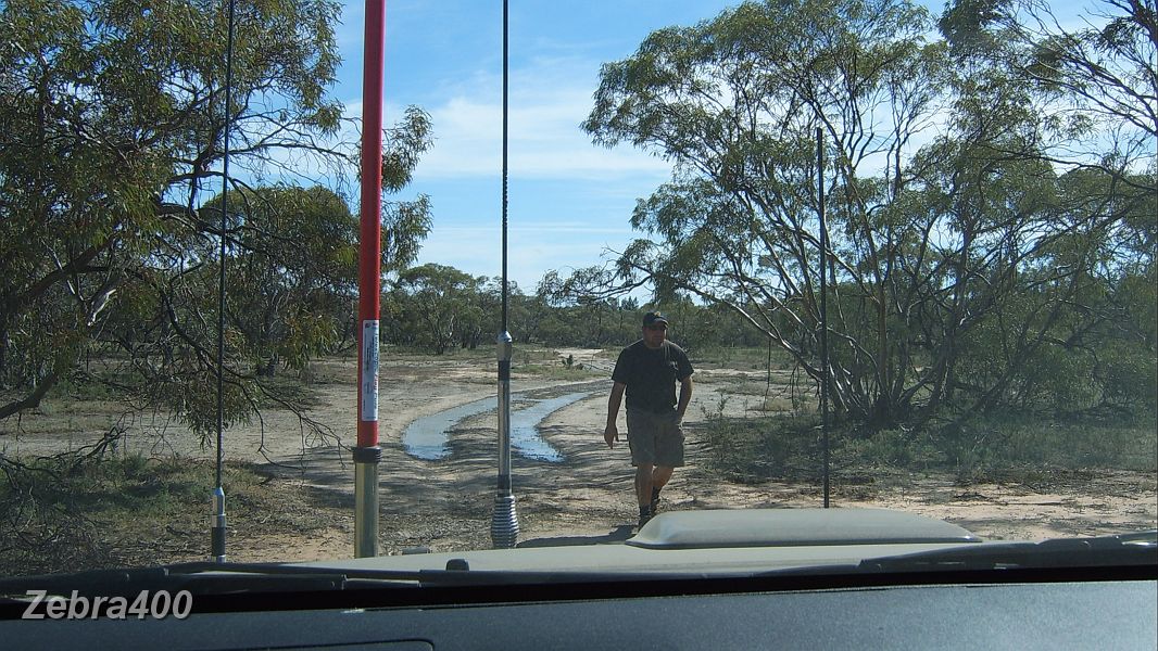 06-Shane returns from checking out the boggy Big Desert track.JPG